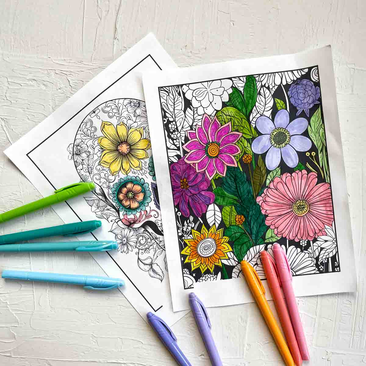 Detailed coloring pages for adults in progress of being colored in.